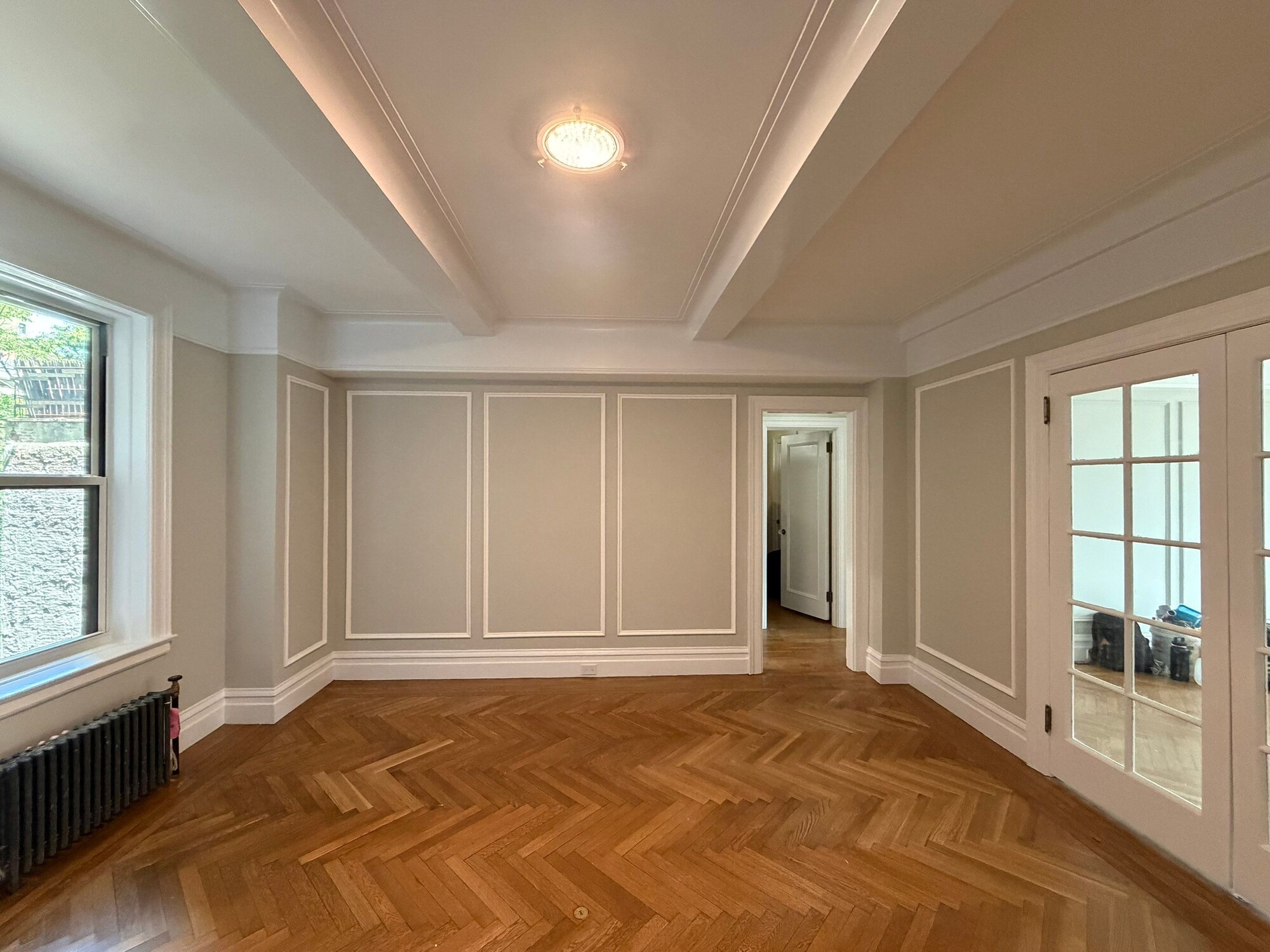 modo renovations home remodeling in manhattan ny empty room with coffered ceiling and herringbone floor