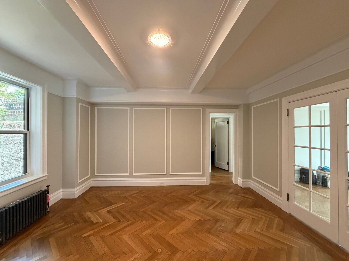 modo renovations home remodeling in manhattan ny empty room with coffered ceiling and herringbone floor
