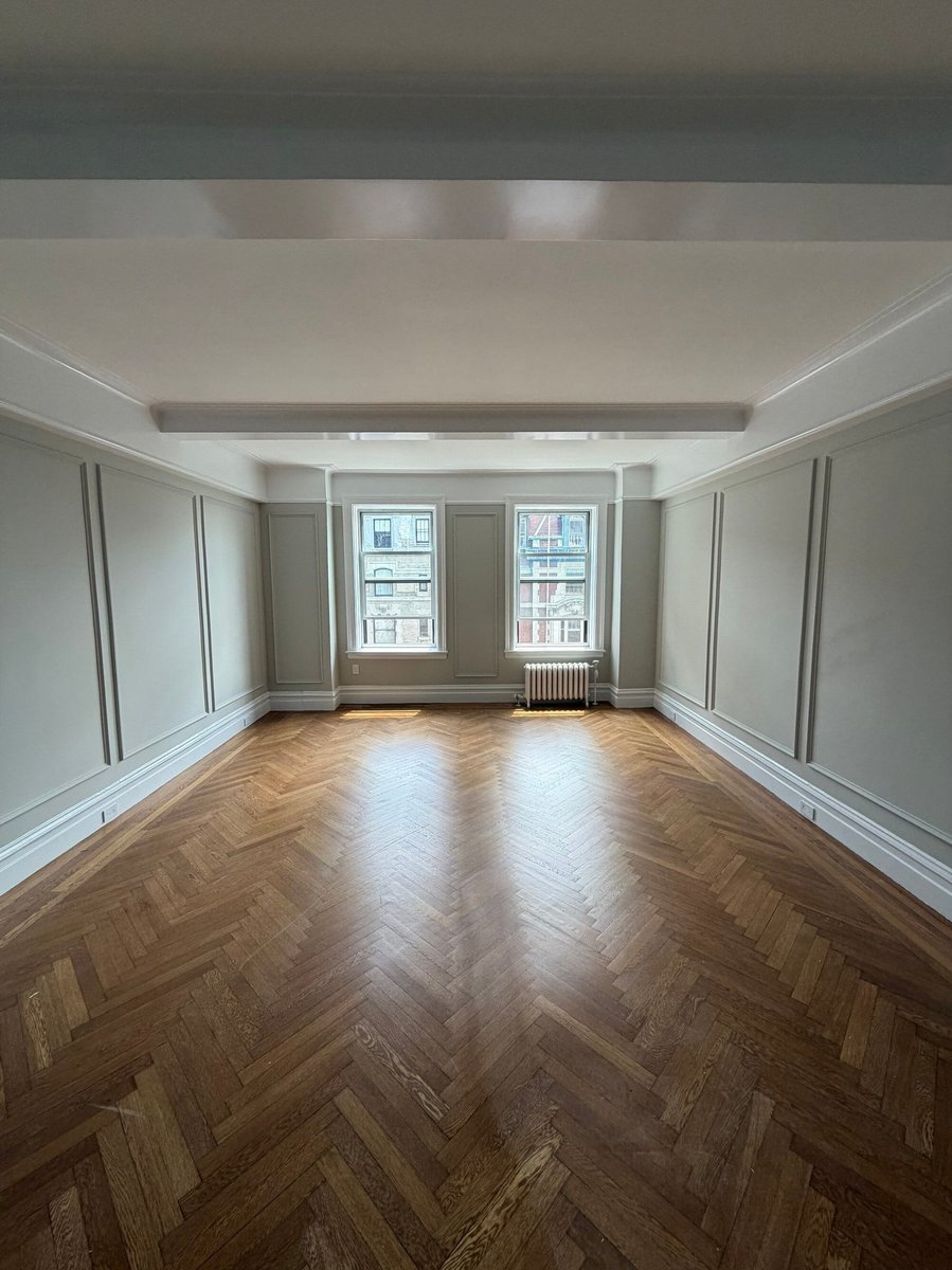modo renovations home remodeling in manhattan ny empty room with herringbone floor and city view windows