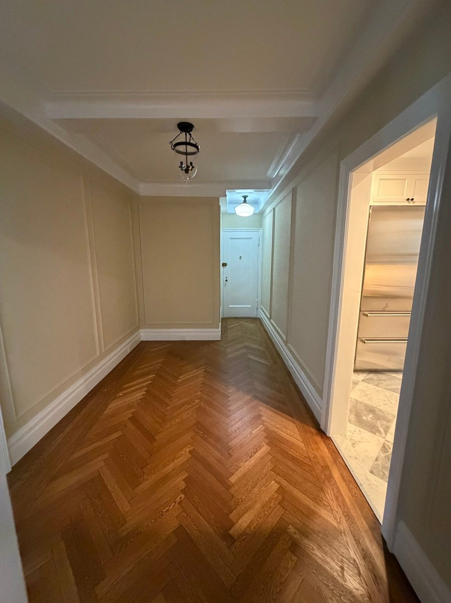 modo renovations home remodeling in manhattan ny entry hallway with herringbone floor and coat closet