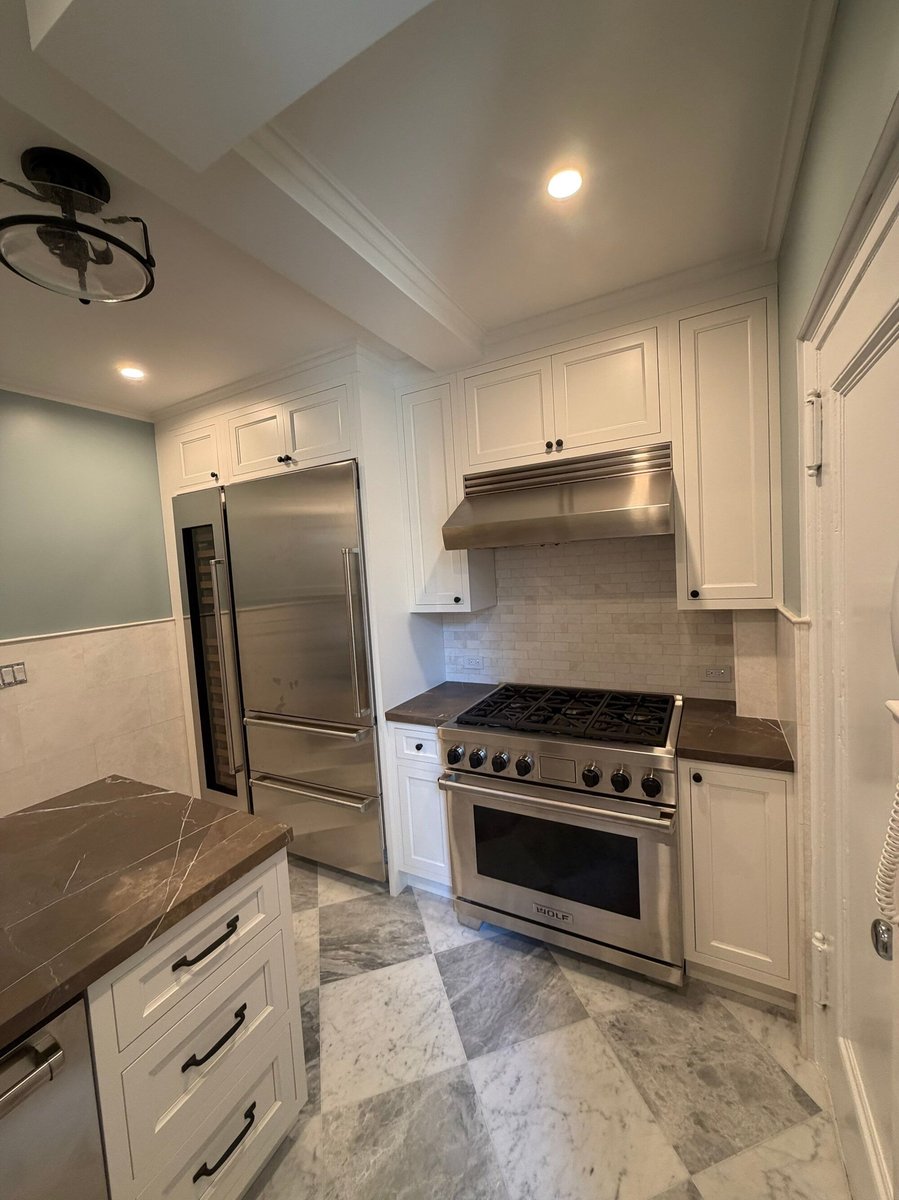 modo renovations kitchen remodeling in manhattan ny featuring stainless steel refrigerator and gas range