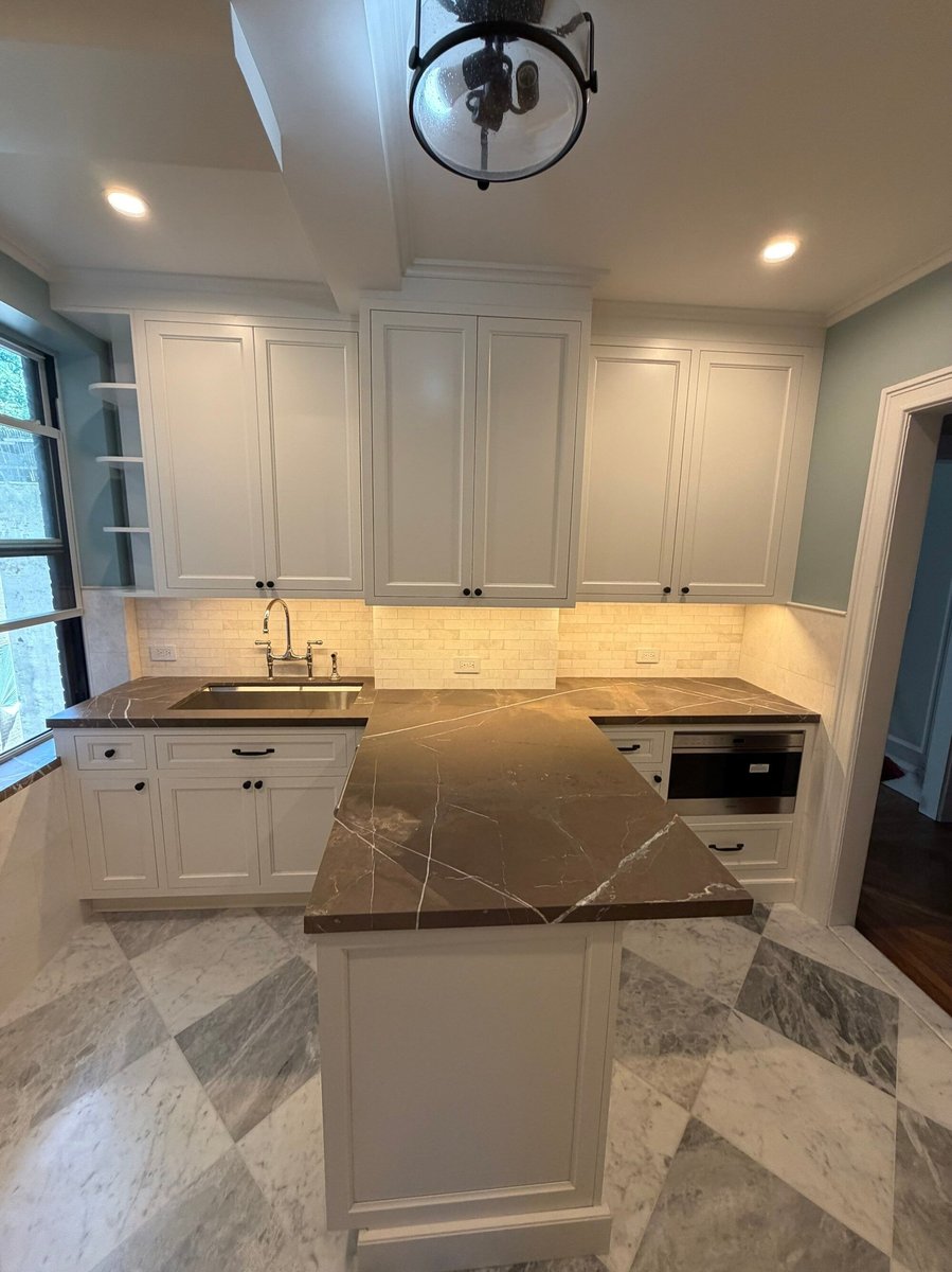 modo renovations kitchen remodeling in manhattan ny showing u shaped island with built in microwave