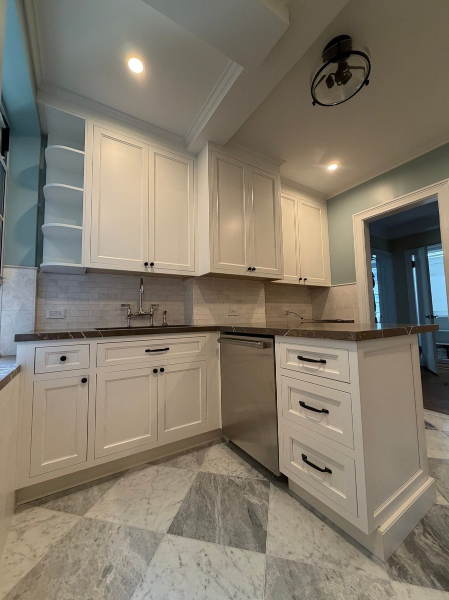 modo renovations kitchen remodeling in manhattan ny with white cabinetry and marble countertop island