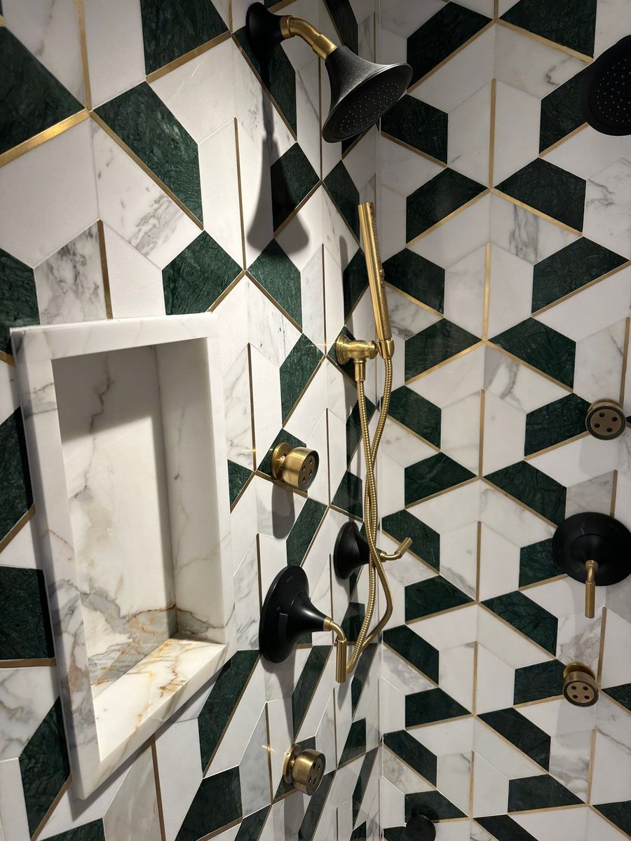 shower niche with brass trim and geometric tile by modo renovations in rye ny home remodel