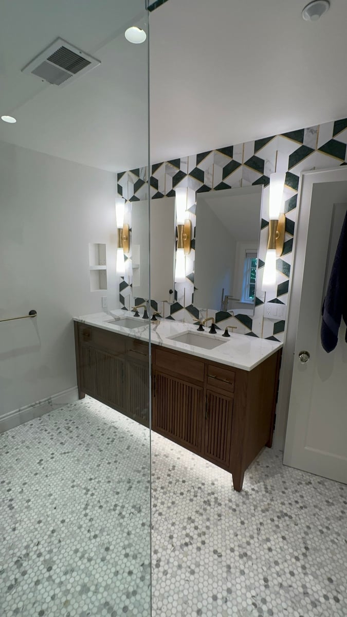 wide bathroom view with double vanity and glass shower by modo renovations in rye ny home remodel